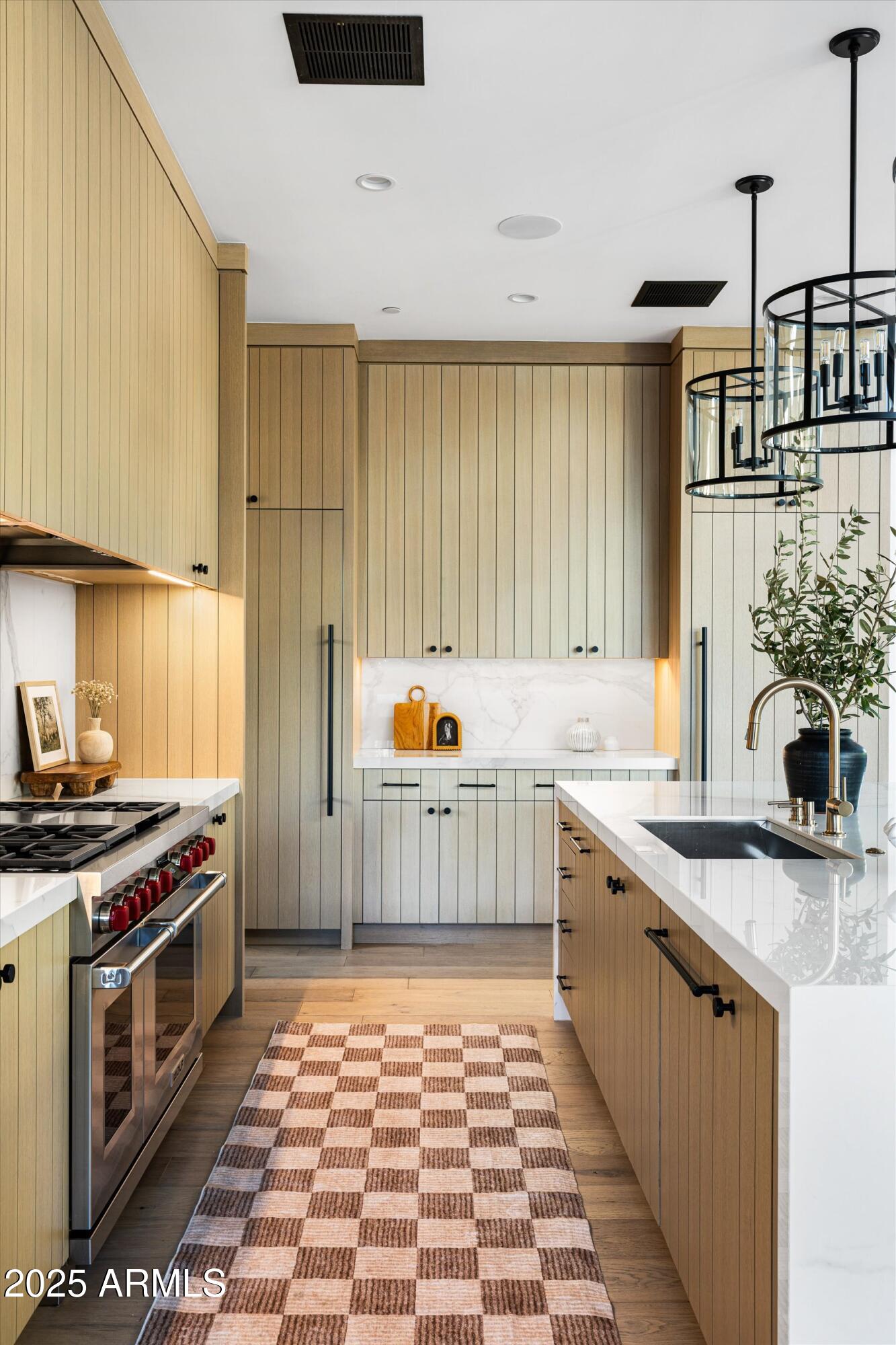 5715 East Monterosa Street Phoenix, AZ 85018 - Photo 9 of 113 a kitchen with stainless steel appliances a stove a sink and a cabinets