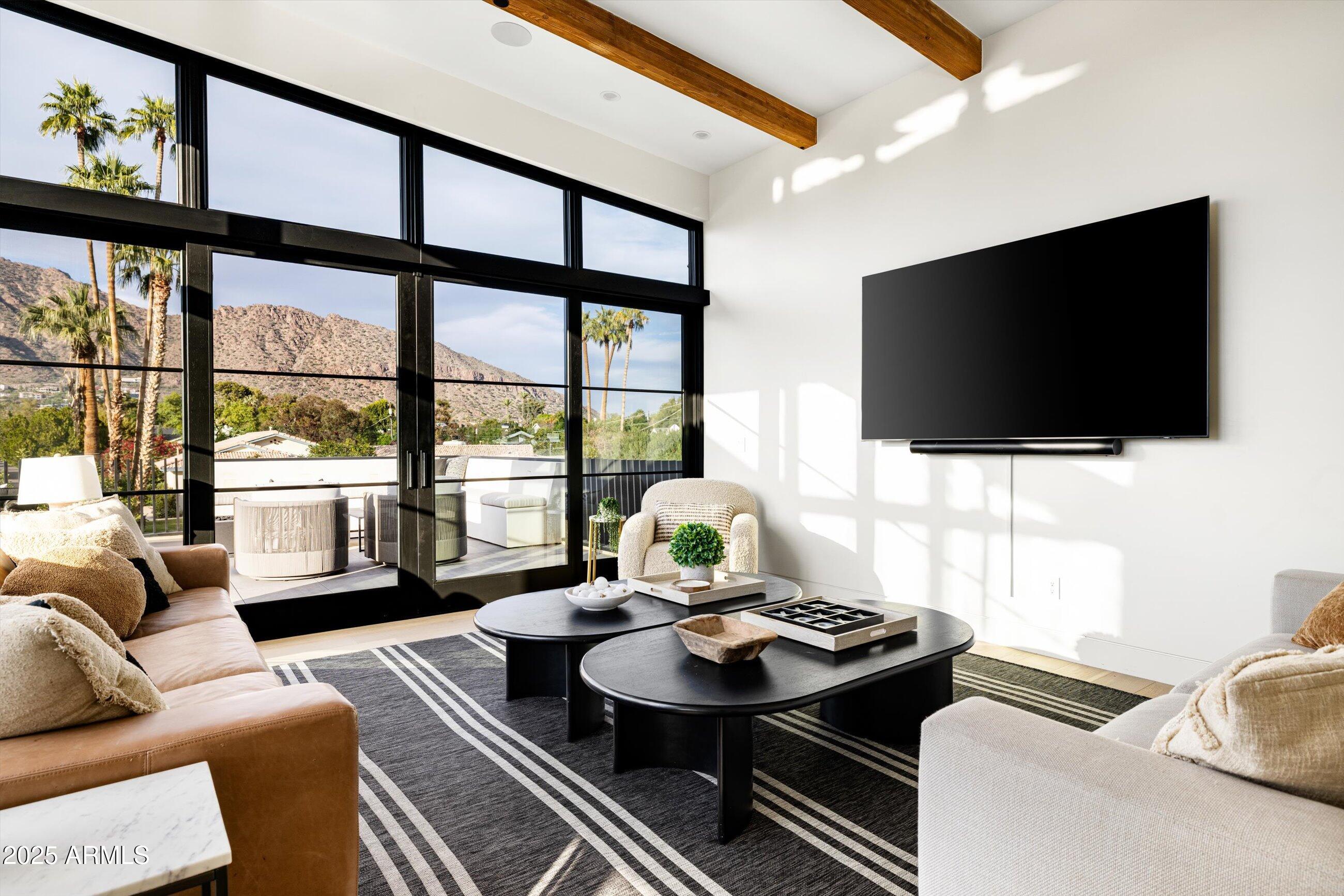 5715 East Monterosa Street Phoenix, AZ 85018 - Photo 91 of 113 a living room with furniture and a flat screen tv