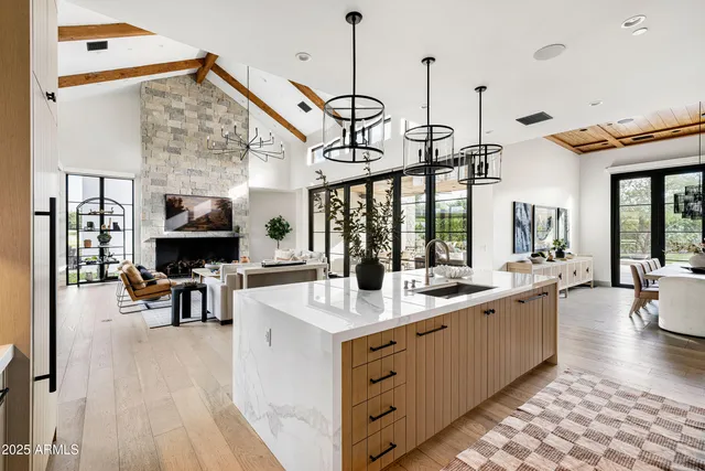 a bathroom with a double vanity sink a mirror and a shower