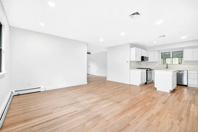 a view of kitchen with wooden floor