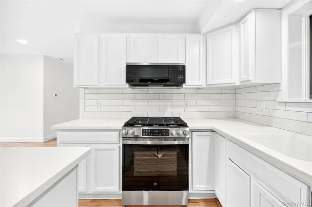 a kitchen with a stove and a sink