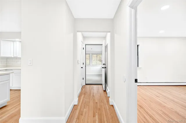 a view of a bedroom from a hallway