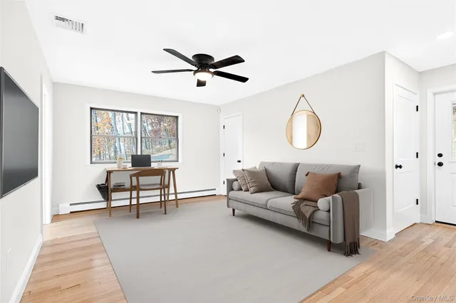 a living room with furniture and a window