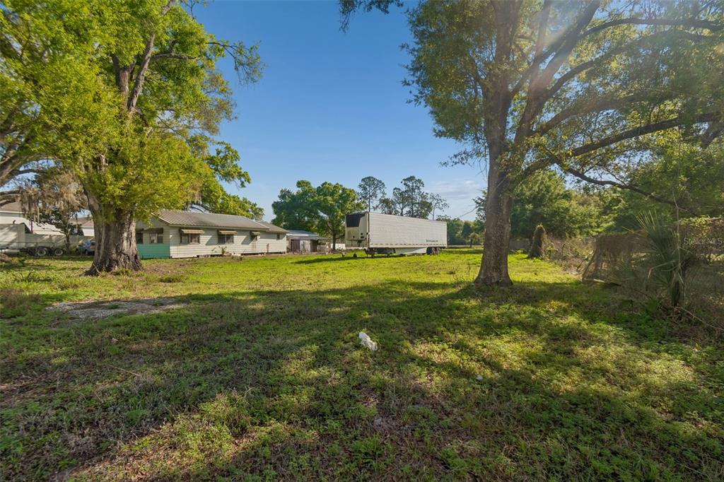 6213 Orient Road Tampa, FL 33610 - Photo 35 of 51 a view of a house with a yard