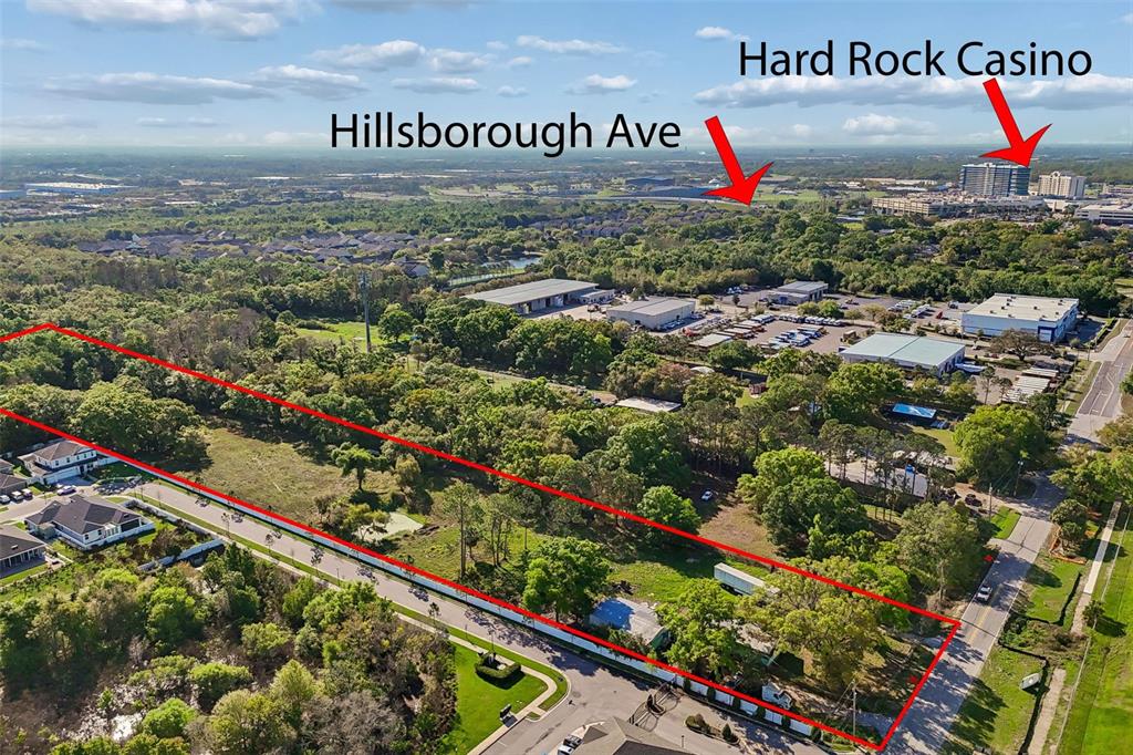 6213 Orient Road Tampa, FL 33610 - Photo 5 of 51 a view of a sign board with wooden fence