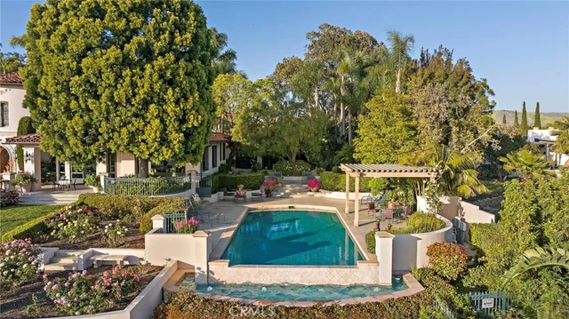 a view of a backyard with sitting area