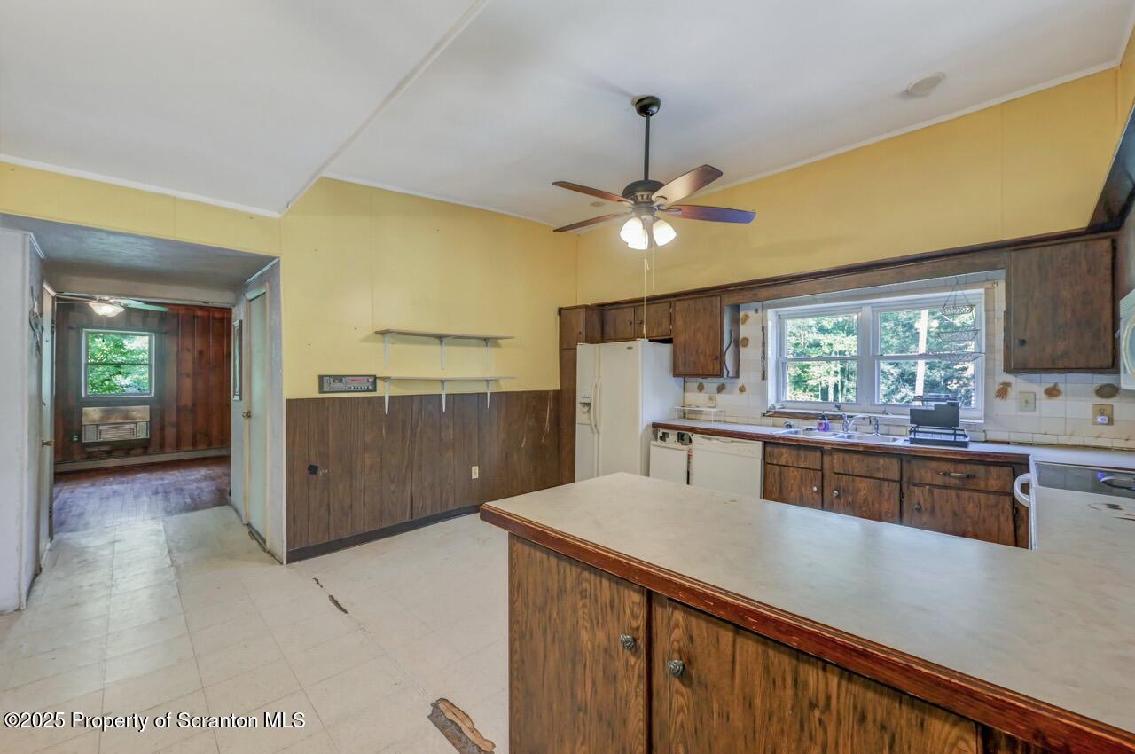 50 Little Lake Road Lake Ariel, PA 18436 - Photo 13 of 73 a kitchen with stainless steel appliances granite countertop a sink a stove and a refrigerator