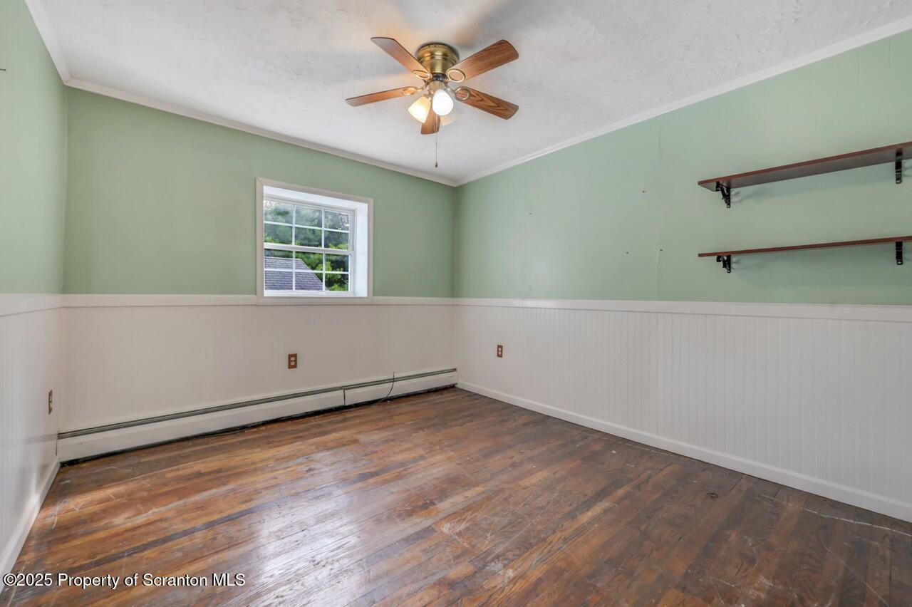 50 Little Lake Road Lake Ariel, PA 18436 - Photo 24 of 73 an empty room with a window and a ceiling fan