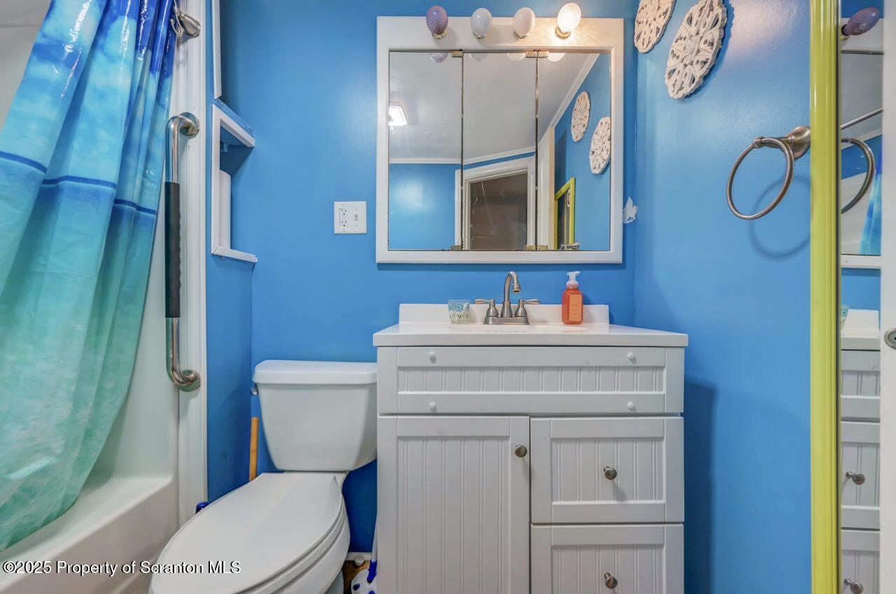 50 Little Lake Road Lake Ariel, PA 18436 - Photo 28 of 73 a bathroom with a sink a toilet and a mirror