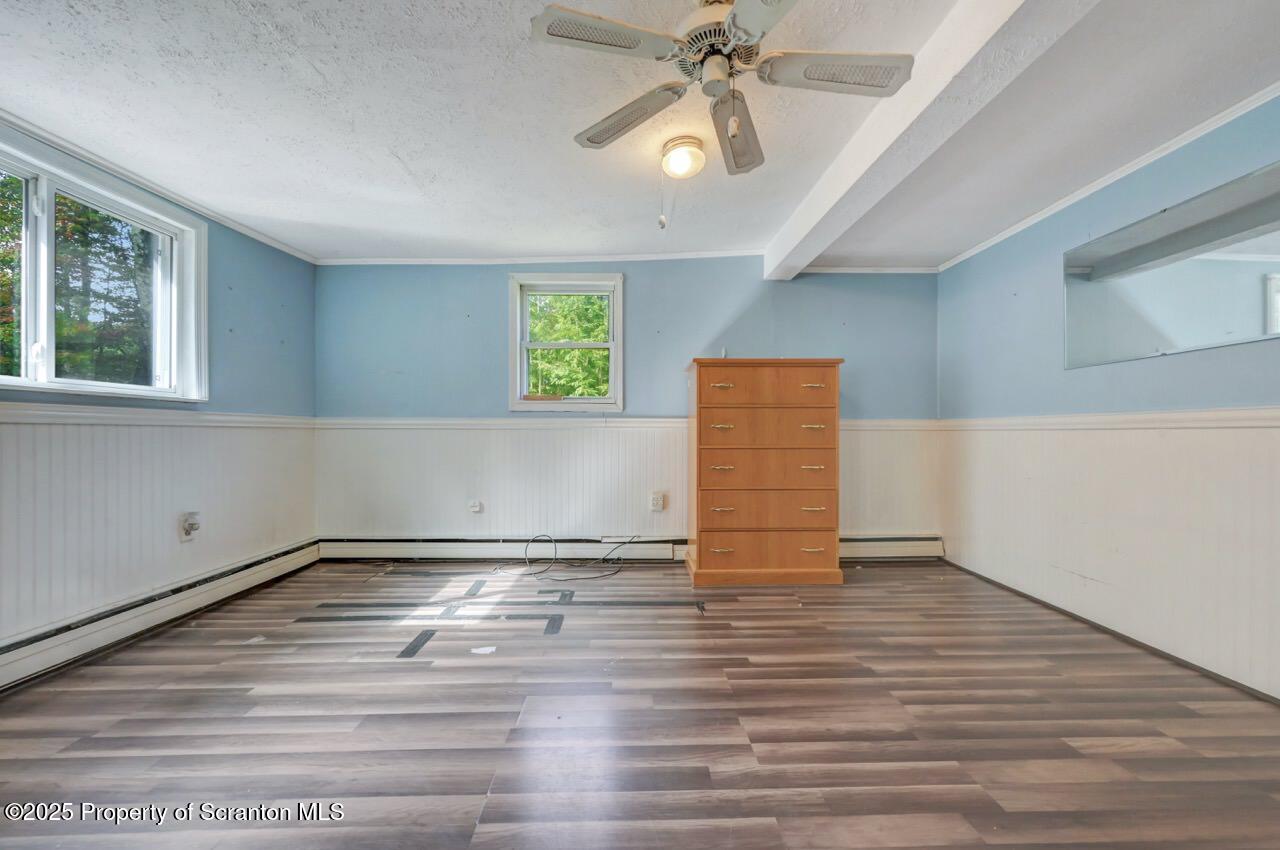 50 Little Lake Road Lake Ariel, PA 18436 - Photo 31 of 73 a view of an empty room with window and wooden floor