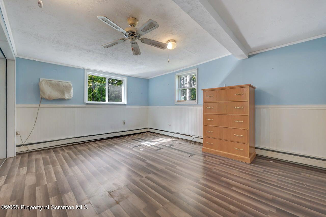 50 Little Lake Road Lake Ariel, PA 18436 - Photo 32 of 73 a view of an empty room with a window and wooden floor