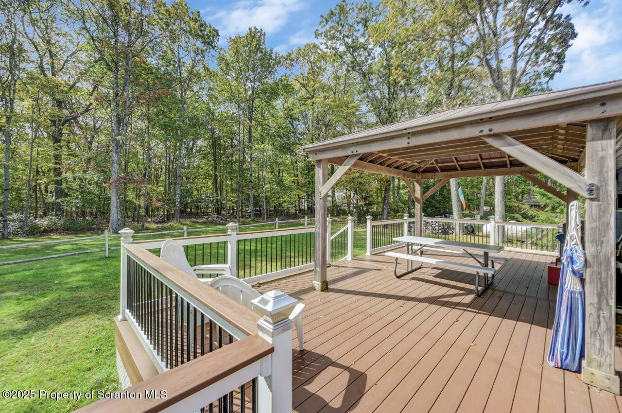 50 Little Lake Road Lake Ariel, PA 18436 - Photo 56 of 73 a view of a deck with wooden floor and roof with a garden view