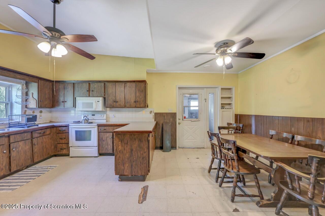 50 Little Lake Road Lake Ariel, PA 18436 - Photo 6 of 73 a kitchen with a table chairs and a stove