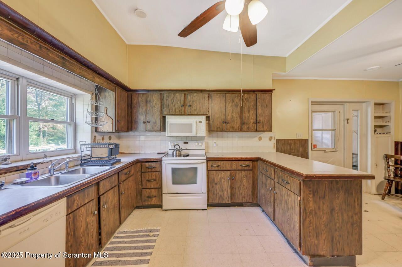 50 Little Lake Road Lake Ariel, PA 18436 - Photo 8 of 73 a kitchen with stainless steel appliances granite countertop a sink and cabinets