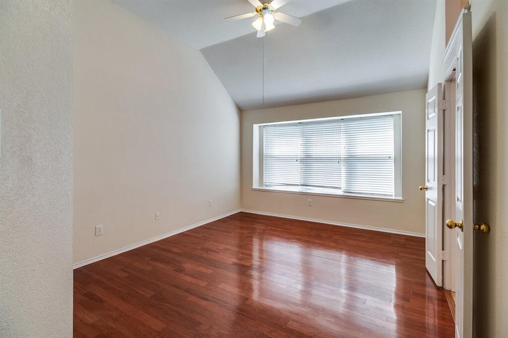 1304 Meredith Drive Allen, TX 75002 - Photo 18 of 28 an empty room with wooden floor and windows
