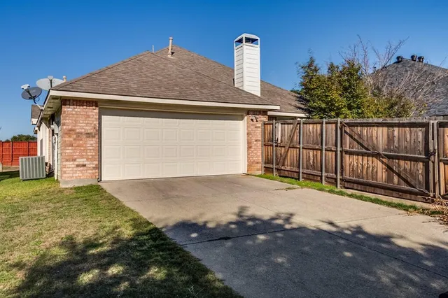 a view of a house with a fence