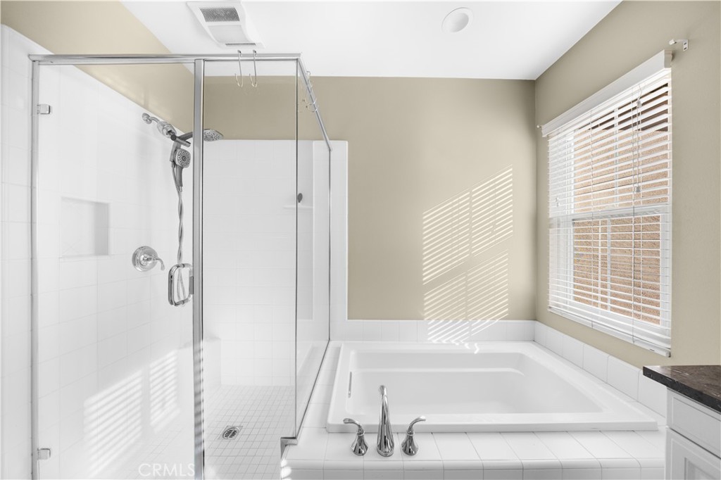 24 Lacebark, Unit 48 Irvine, CA 92618 - Photo 15 of 21 a bathroom with a bathtub and a shower
