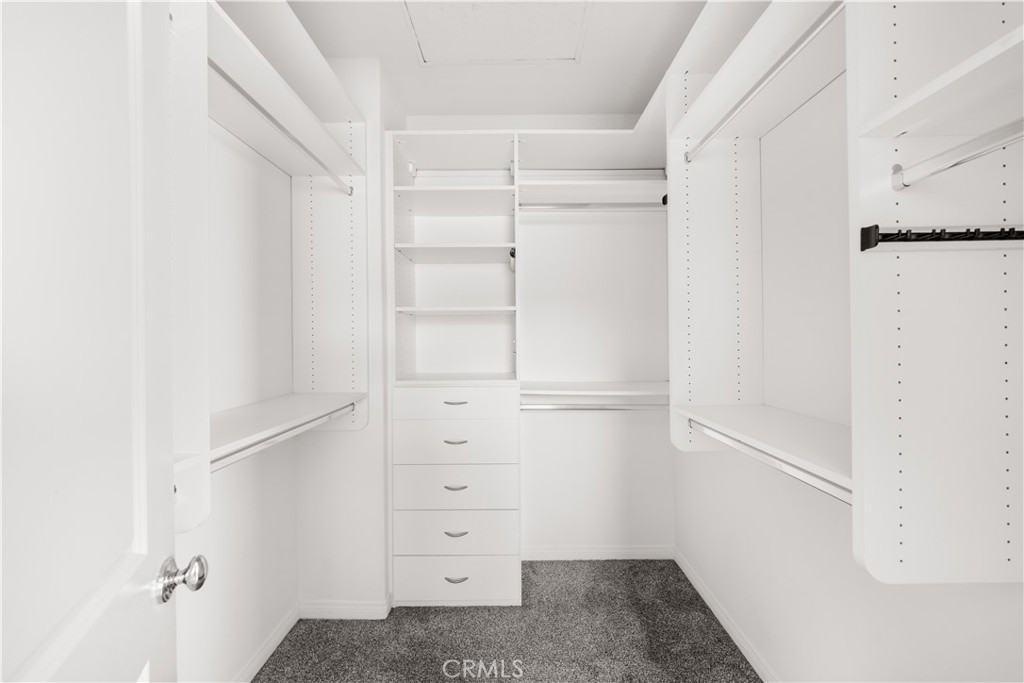 24 Lacebark, Unit 48 Irvine, CA 92618 - Photo 16 of 21 a view of walk in closet with empty racks