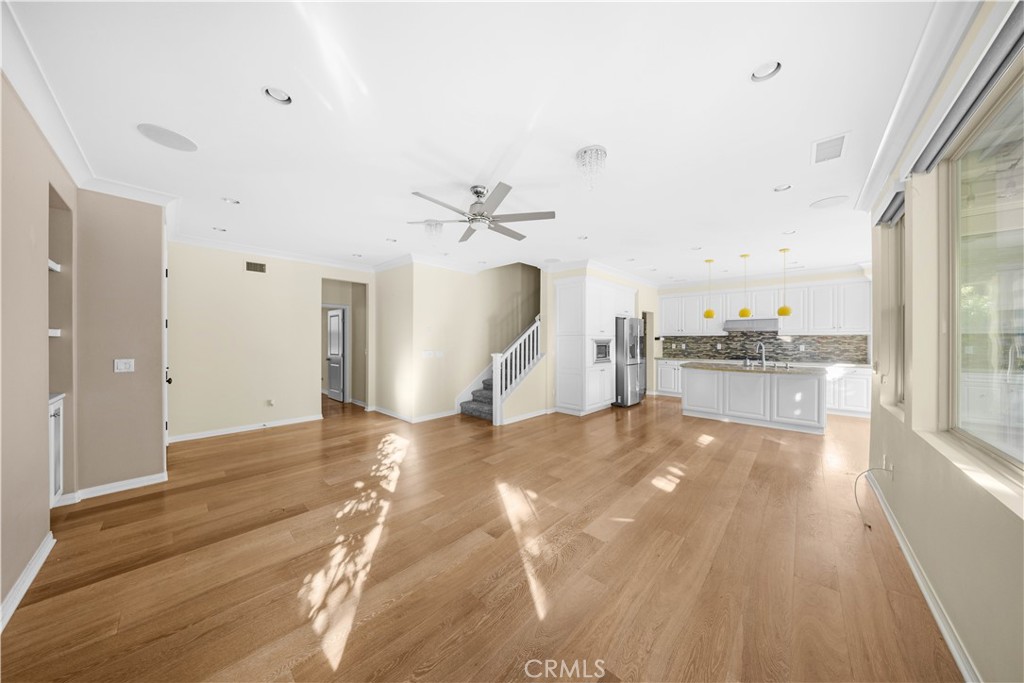 24 Lacebark, Unit 48 Irvine, CA 92618 - Photo 3 of 21 a view of a kitchen with a sink and a large window