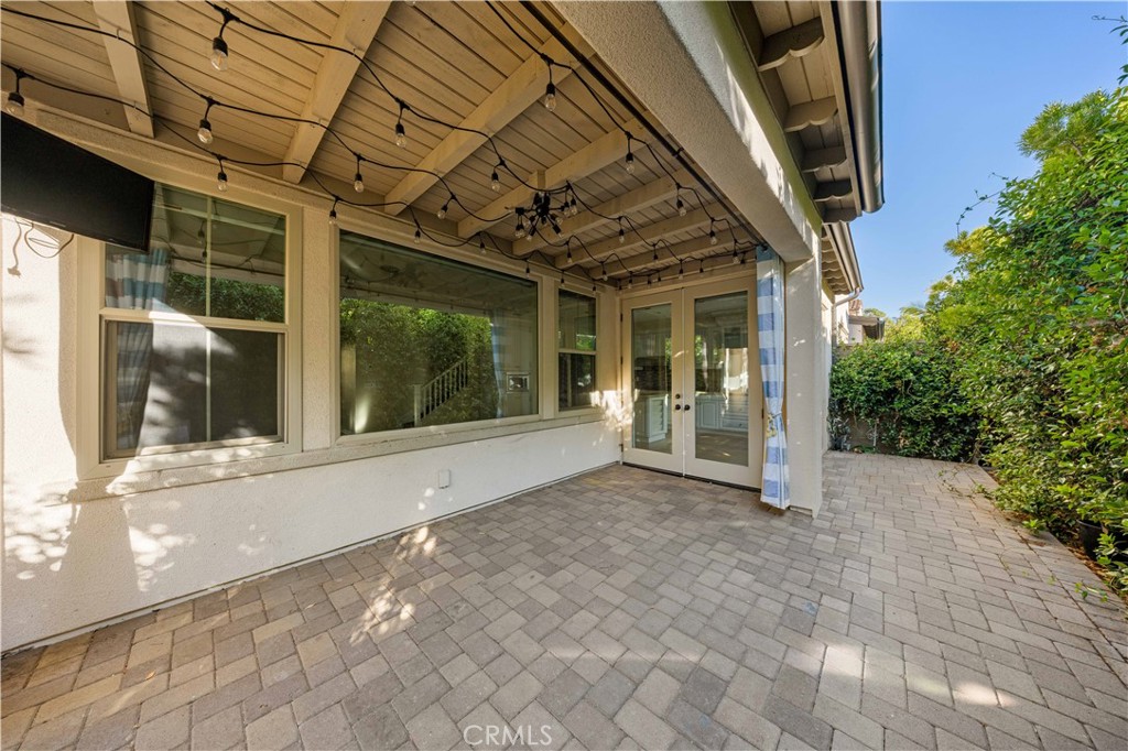 24 Lacebark, Unit 48 Irvine, CA 92618 - Photo 5 of 21 a view of a house with porch and garden