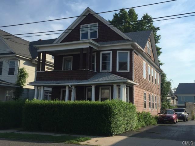 60 King Street Bridgeport, CT 06605 - Photo 1 of 1 a front view of a residential apartment building with a yard