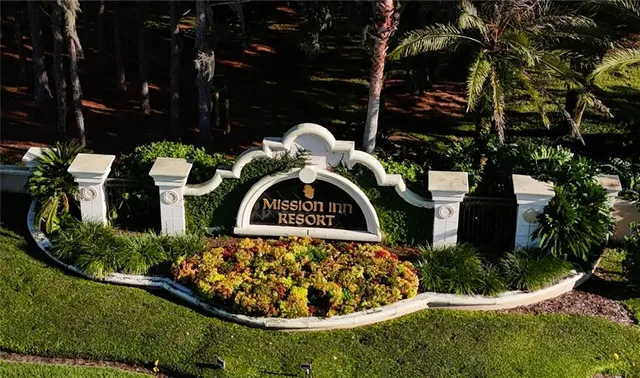 an aerial view of a residential houses with outdoor space and street view