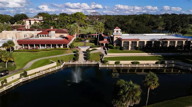 an aerial view of multiple houses with yard