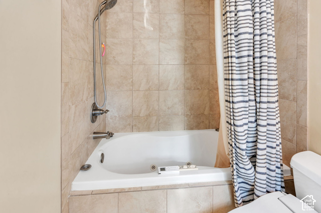 892 Bear Canyon Road Sandy, UT 84094 - Photo 21 of 36 Tiled shower surround with a corner soaking tub and a brushed nickel shower fixture