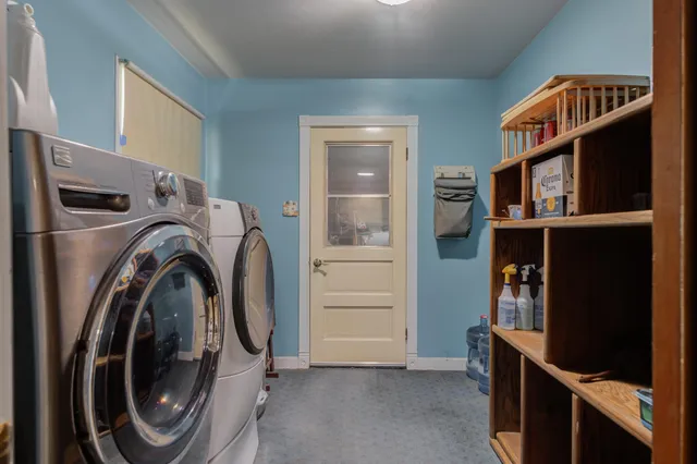 a utility room with closet dryer and washer