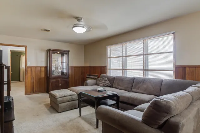 a living room with furniture and a window