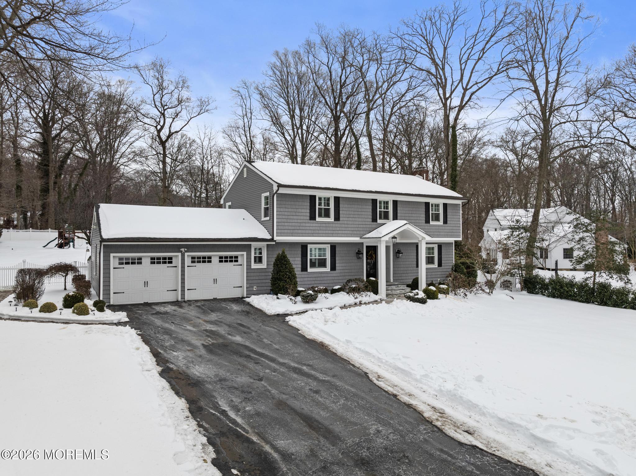 49 Stork Court Middletown, NJ 07748 - Photo 2 of 49 a front view of a house with yard covered in snow