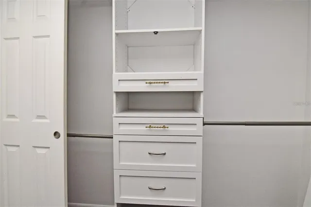 a close view of washer and dryer with white cabinet
