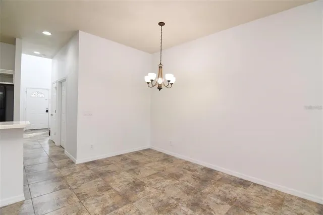 a view of a chandelier in an empty room