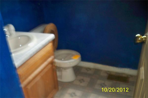 64 Mission Road Tyngsborough, MA 01879 - Photo 3 of 7 a toilet sitting next to a sink