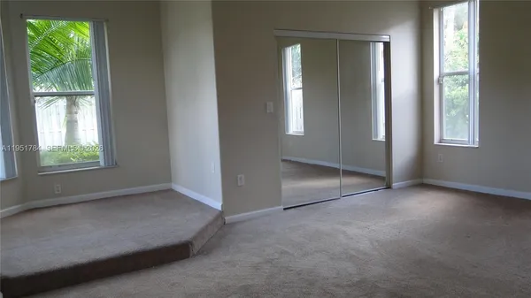 an empty room with windows