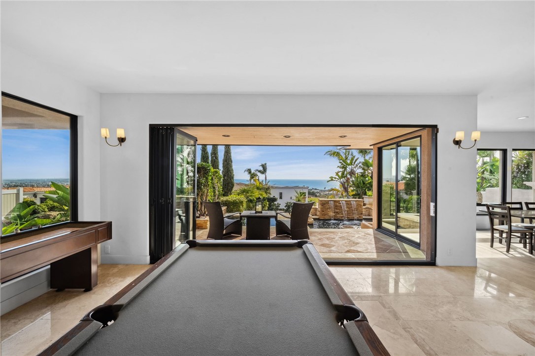 5381 Moonlight Lane La Jolla, CA 92037 - Photo 14 of 44 a living room with furniture and large windows