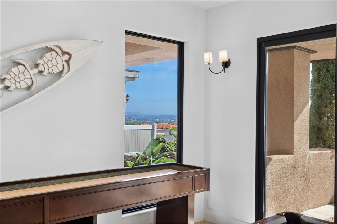 5381 Moonlight Lane La Jolla, CA 92037 - Photo 16 of 44 a room with a bench and potted plant