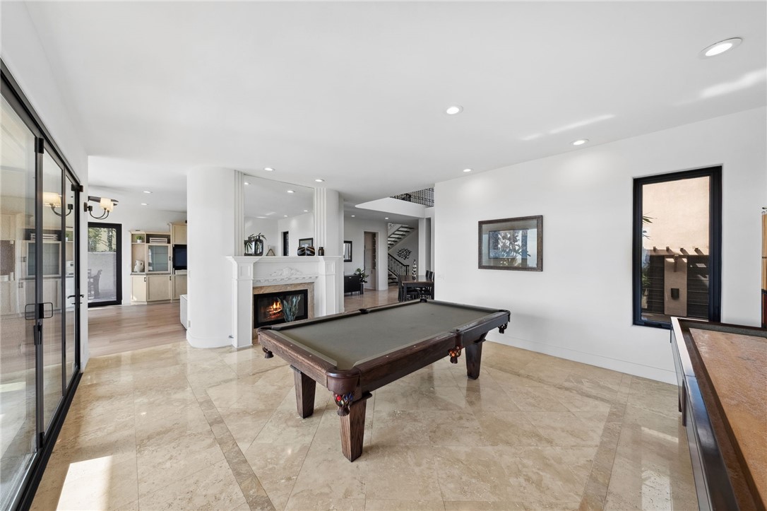 5381 Moonlight Lane La Jolla, CA 92037 - Photo 17 of 44 a living room with furniture and a fireplace