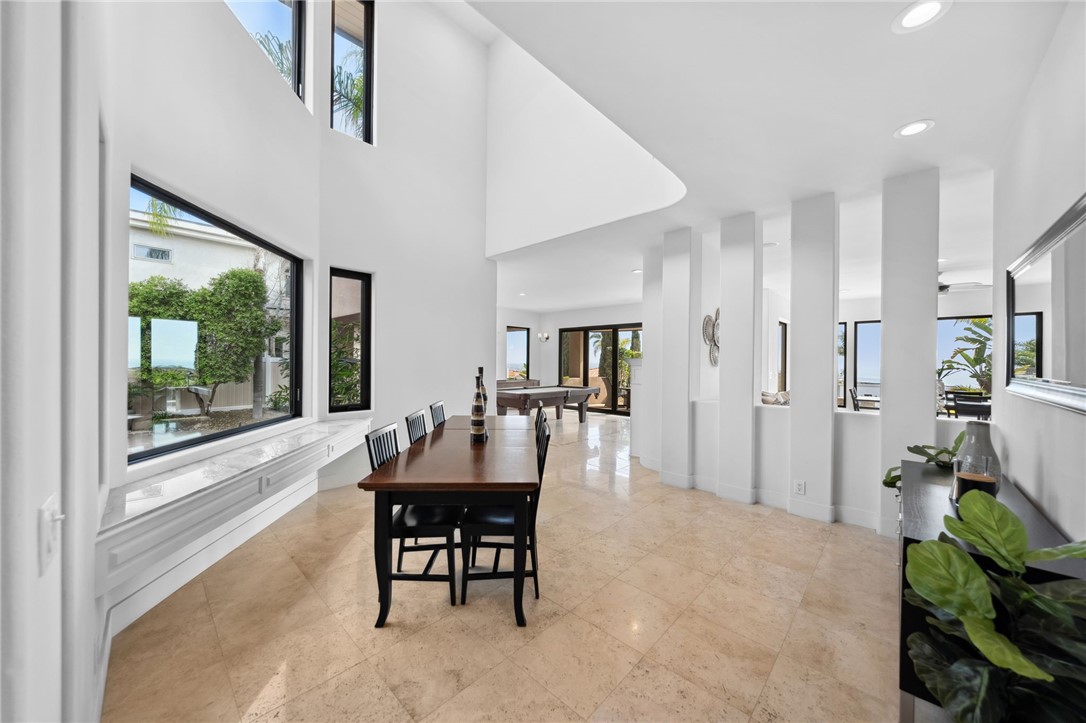 5381 Moonlight Lane La Jolla, CA 92037 - Photo 20 of 44 a dining room with furniture and a floor to ceiling window
