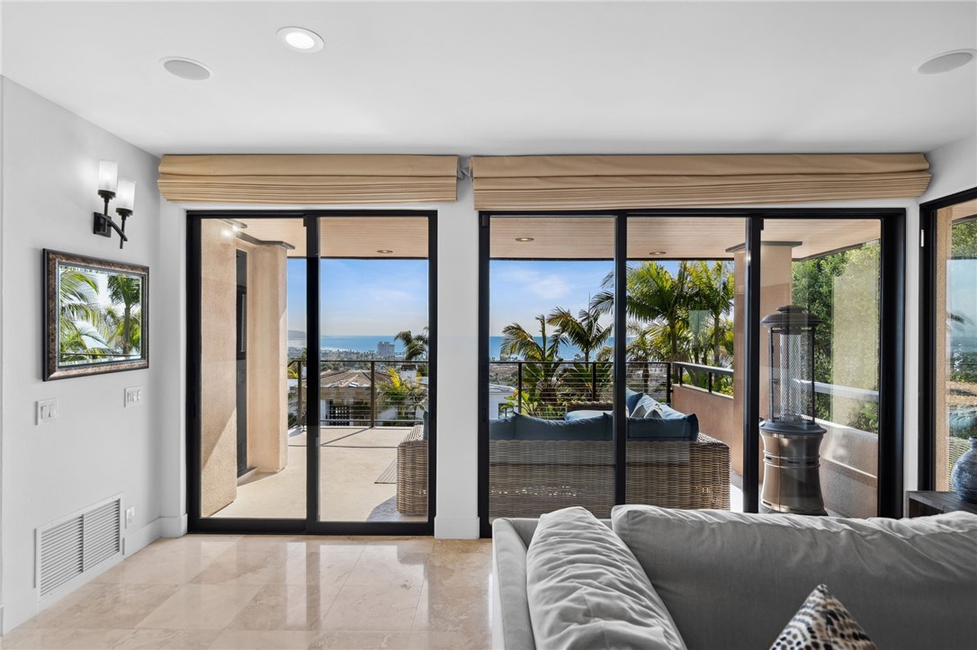 5381 Moonlight Lane La Jolla, CA 92037 - Photo 24 of 44 a living room with furniture and a large window