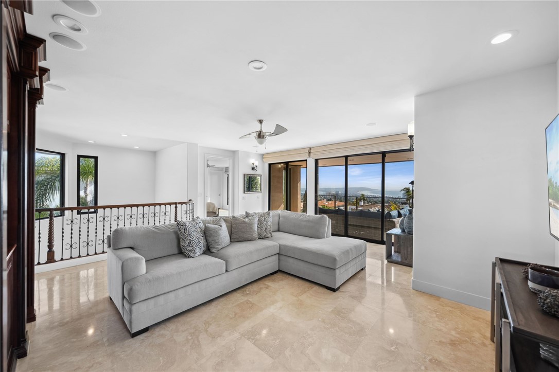 5381 Moonlight Lane La Jolla, CA 92037 - Photo 25 of 44 a living room with furniture and a large window
