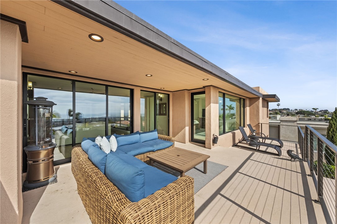 5381 Moonlight Lane La Jolla, CA 92037 - Photo 30 of 44 a living room with couch and large windows