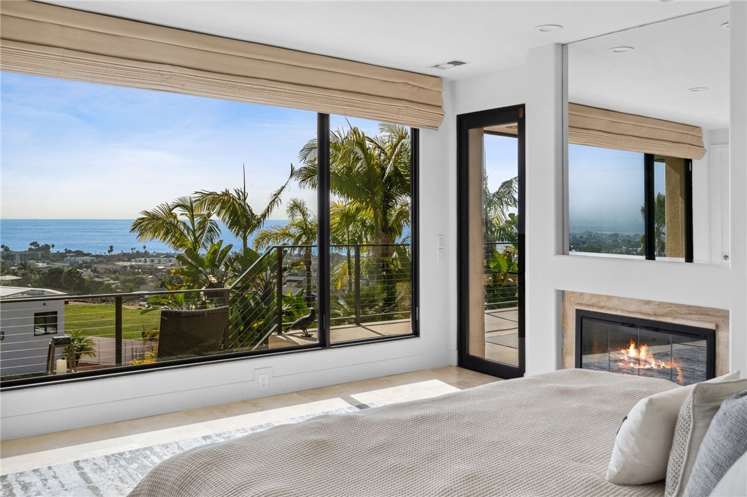 5381 Moonlight Lane La Jolla, CA 92037 - Photo 36 of 44 a living room with furniture and a floor to ceiling window