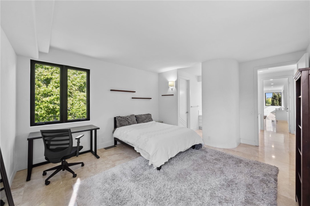 5381 Moonlight Lane La Jolla, CA 92037 - Photo 39 of 44 a room with a bed a desk and chair