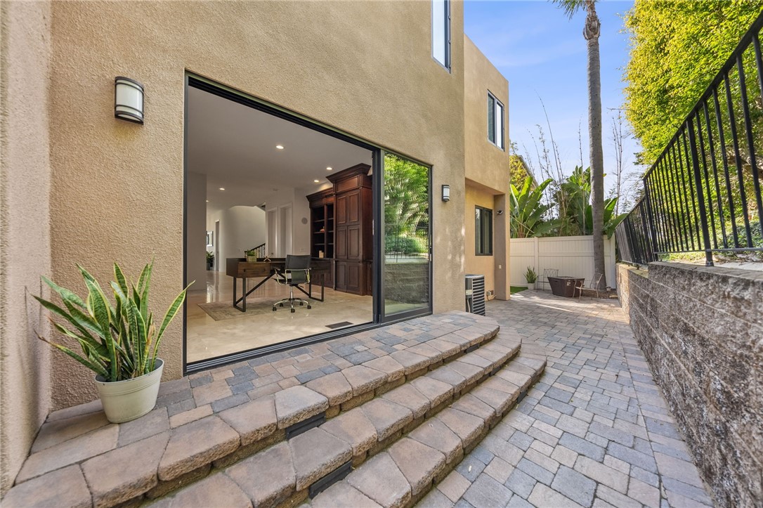 5381 Moonlight Lane La Jolla, CA 92037 - Photo 42 of 44 a view of a lobby with a potted plant and floor to ceiling window