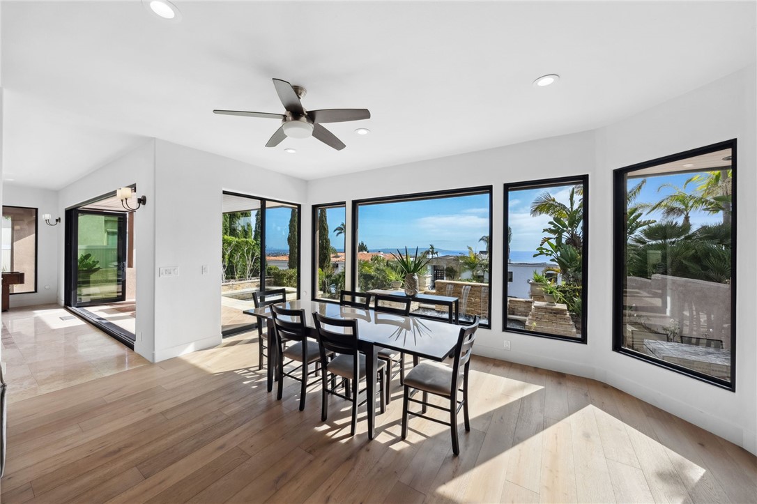 5381 Moonlight Lane La Jolla, CA 92037 - Photo 7 of 44 a view of a dining room with furniture window and wooden floor
