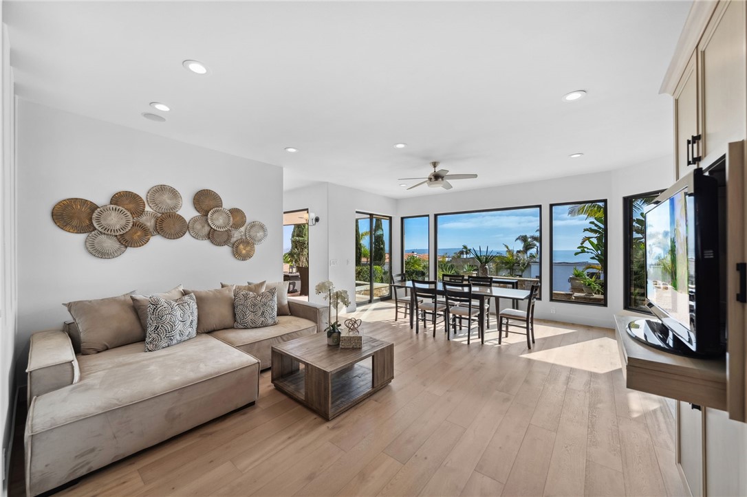 5381 Moonlight Lane La Jolla, CA 92037 - Photo 9 of 44 a living room with furniture and a large window