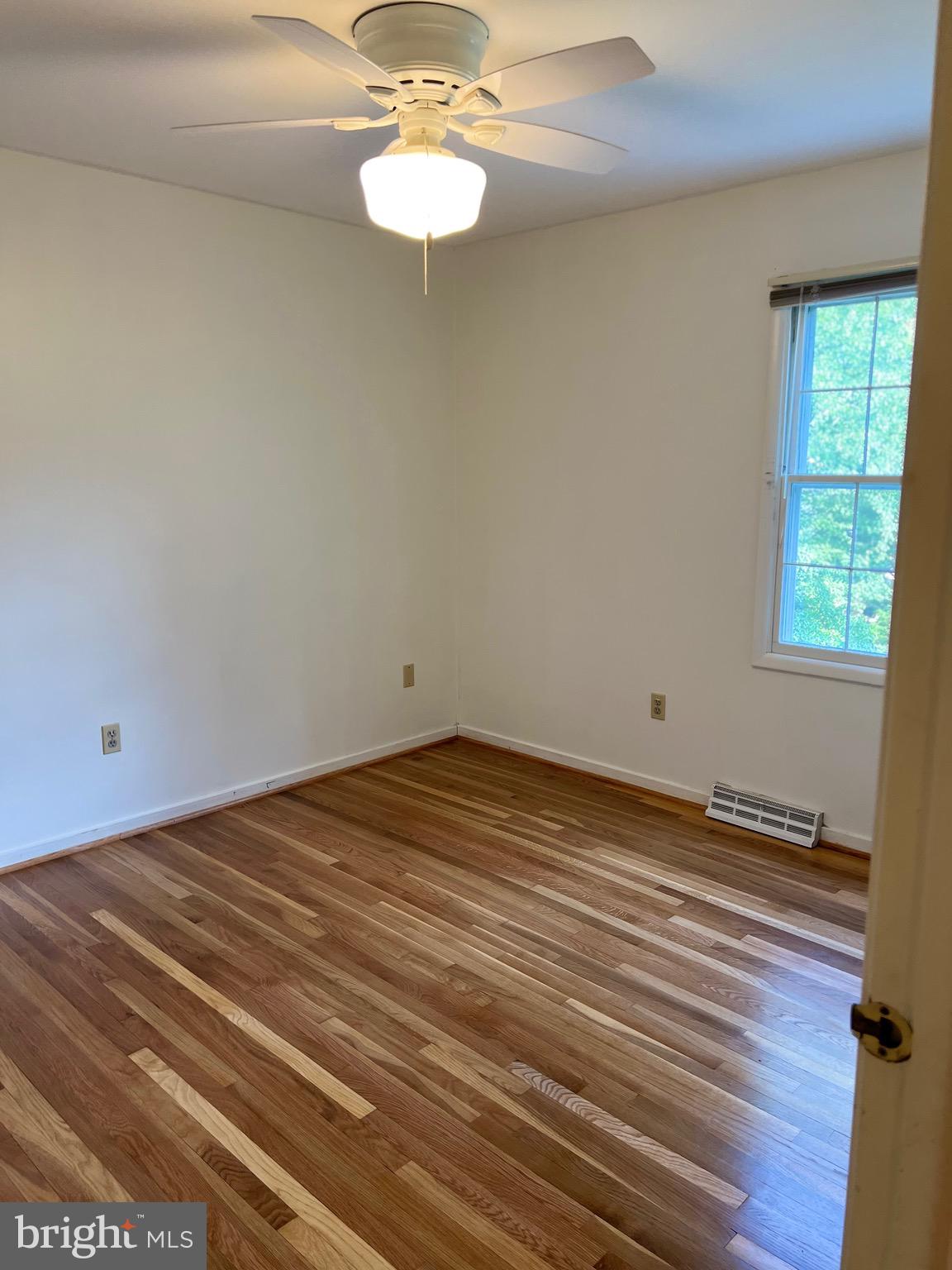 204 Pewter Lane Silver Spring, MD 20905 - Photo 11 of 12 a view of empty room with wooden floor