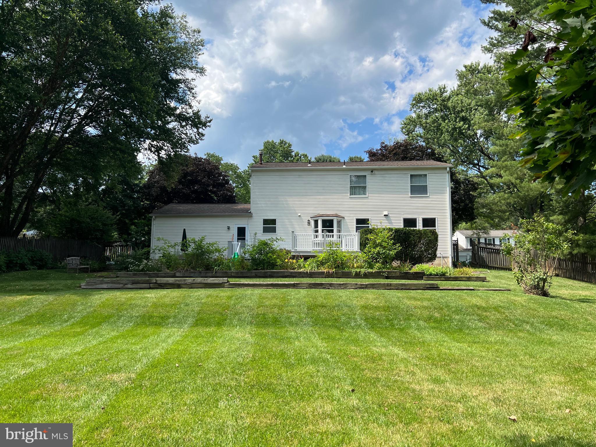 204 Pewter Lane Silver Spring, MD 20905 - Photo 2 of 12 a front view of a house with a yard and trees