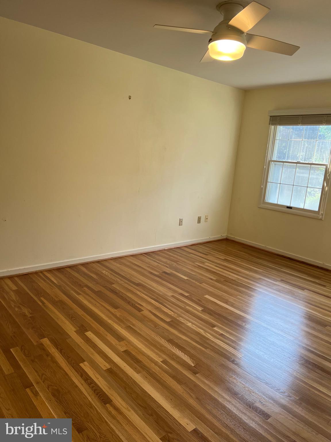 204 Pewter Lane Silver Spring, MD 20905 - Photo 4 of 12 wooden floor in an empty room